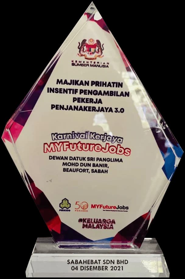 Sabahebat Sdn Bhd's crystal Majikan Prihatin trophy from Malaysia's Ministry of Human Resources, presented on 4 December 2021 at the MYFutureJobs career carnival in Beaufort, Sabah